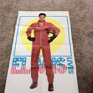 Red Jumpsuit Poster with Yellow Circle Graphic does have a small tear in crease
